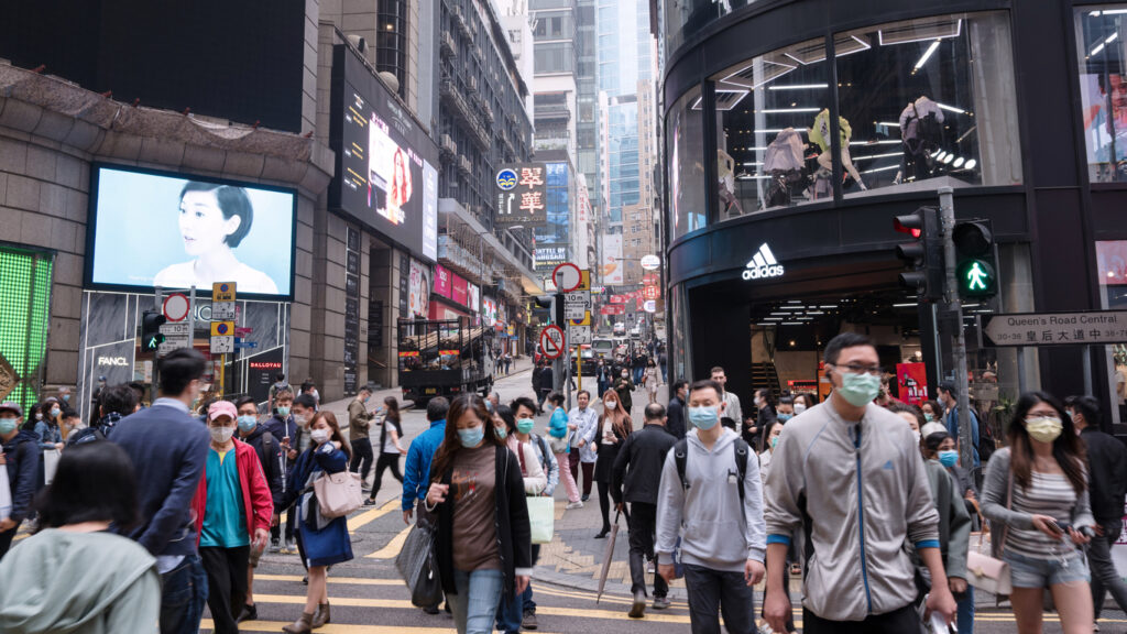 hong streets with people wearing masks