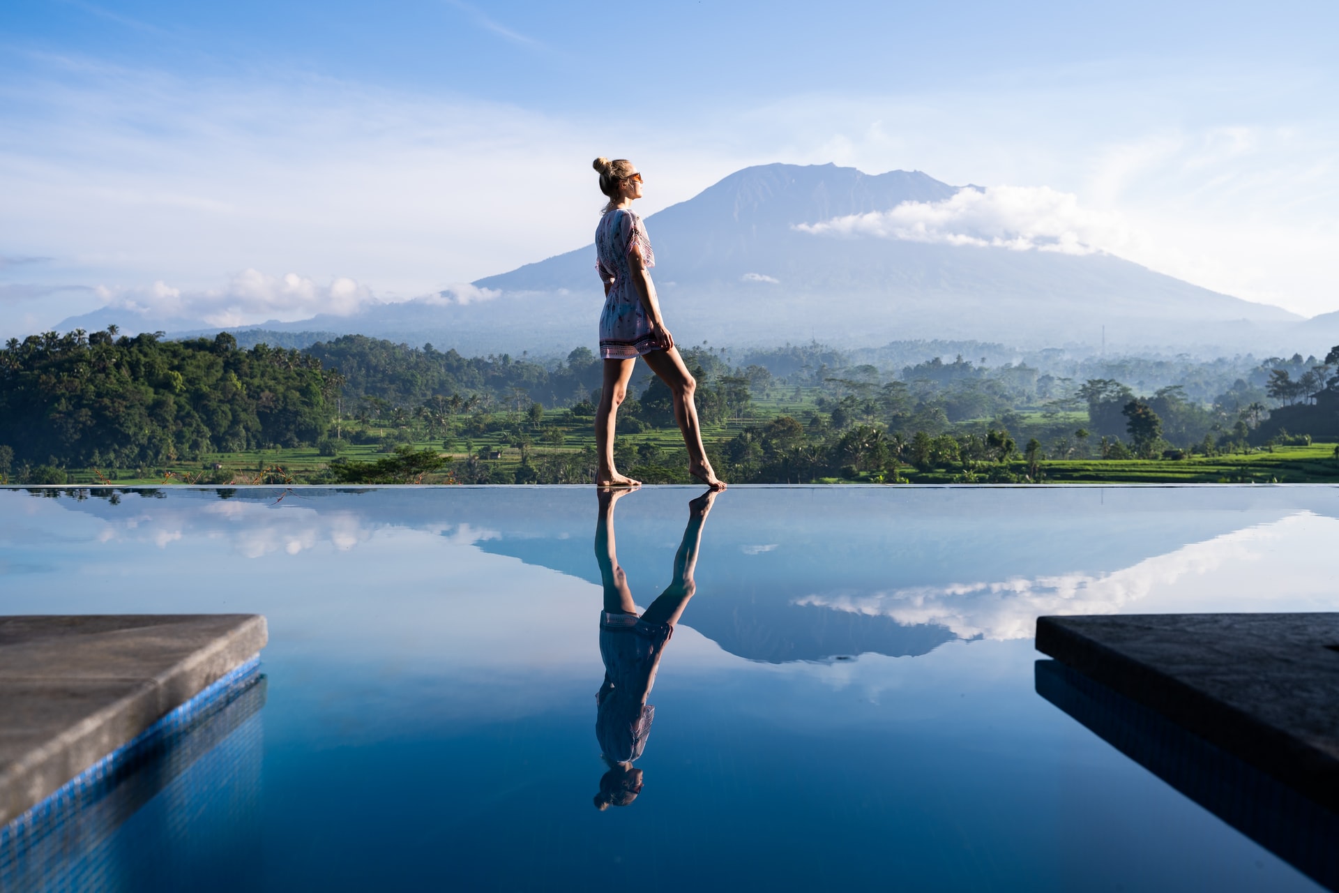 girl taking foto in front volcano in Bali