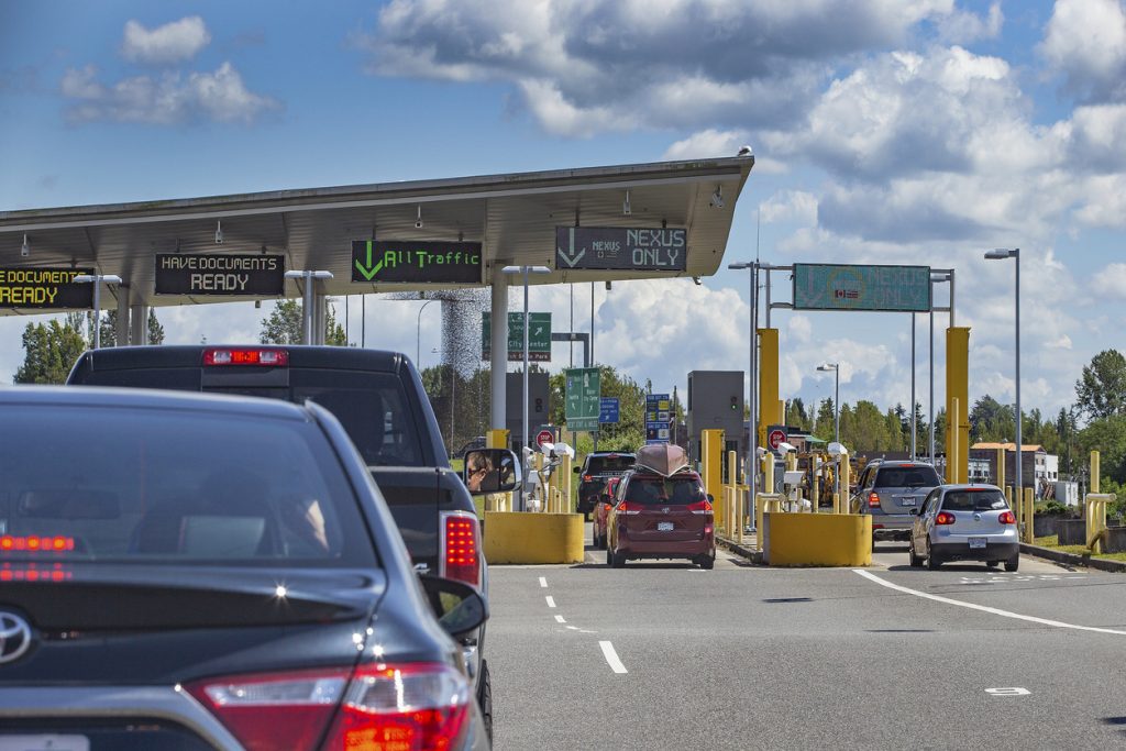 cars  waiting in line at us canada border