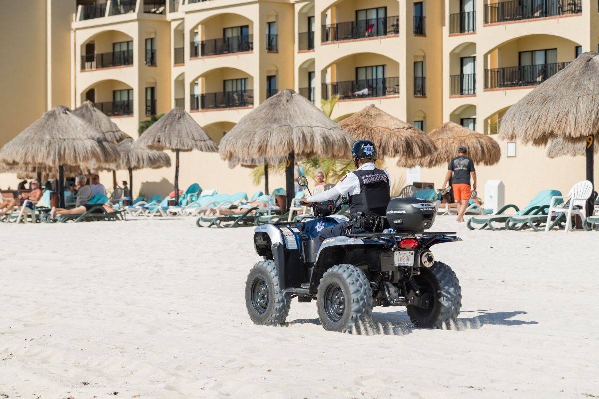 cancun police patroling the beach