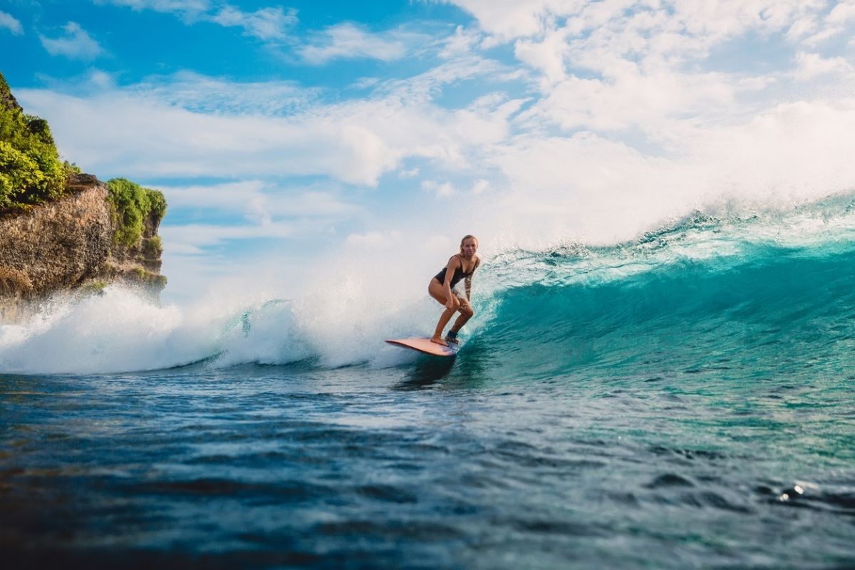girl surfing in bali