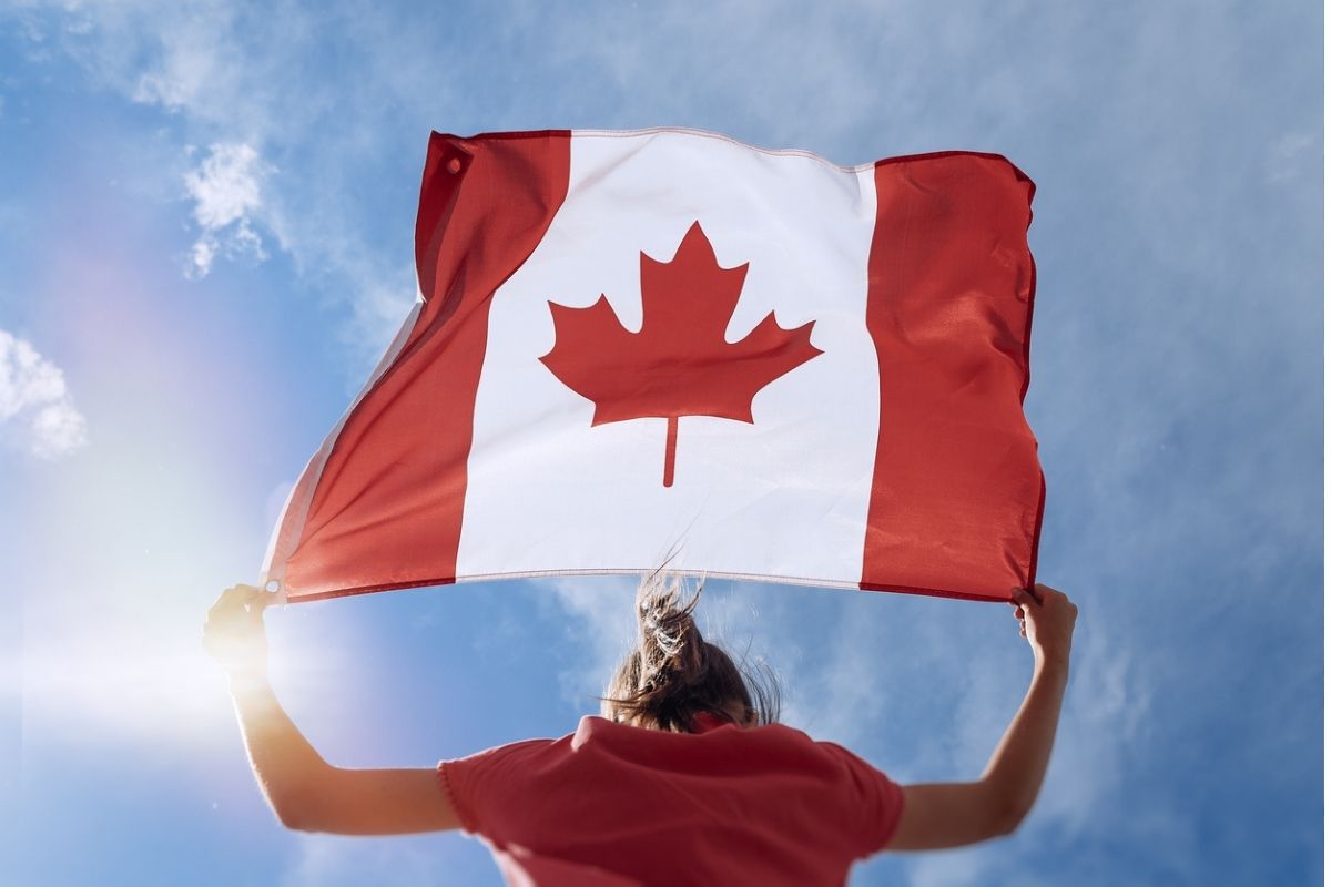 female canadian traveler with the flag
