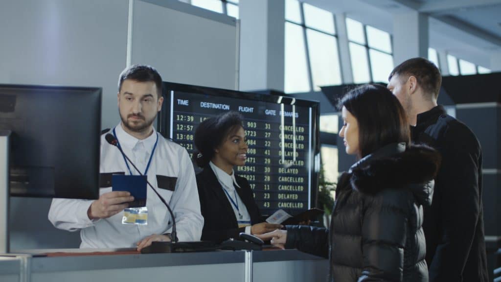 Employees of airport checking Passports and biometric data