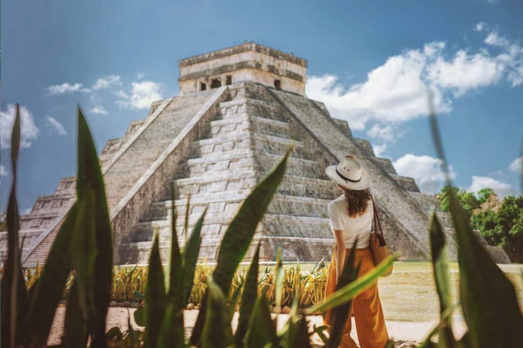 girl visiting mayan ruins